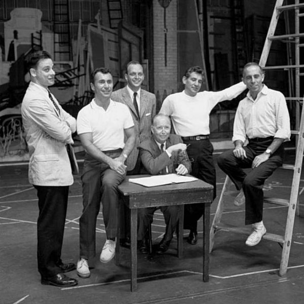 West Side Story creative team, 1957: (left to right) lyricist Steven Sondheim, author Arthur Laurents, co-producer Hal Prince, co-producer Robert Griffith (seated), composer Leonard Bernstein, and choreographer Jerome Robbins.